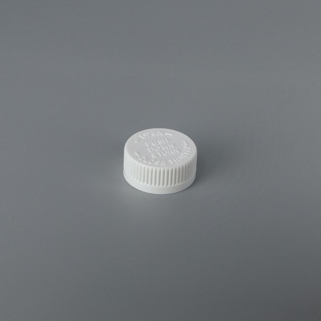 33mm Embossed Child-Resistant Push Down Cap - Image 1