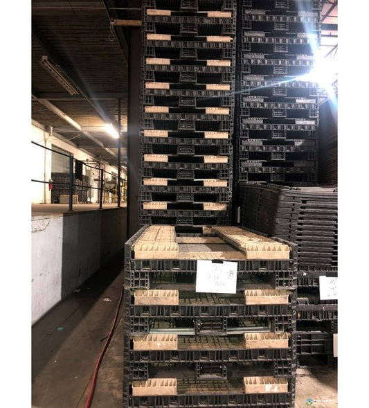 Collapsible Plastic Pallet Container with 2 Drop Doors, Black Base and Tan Walls, 78x48x25 in - Image 1